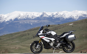 Motorcycle BMW S1000 XR on the background of snow-capped mountains