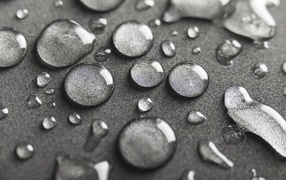 A lot of drops on a gray background