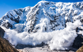 Avalanche coming off the snow-capped Alps, Switzerland