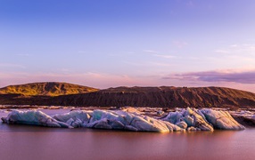 Melting glaciers under a beautiful lilac sky
