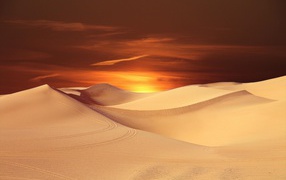 Endless desert under a beautiful sky at sunset