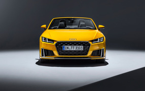 Yellow car Audi TT Roadster S line, 2019 year on a gray background