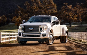 White Ford Super Duty pickup on the farm