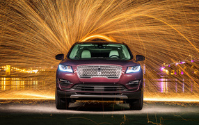 SUV Lincoln MKC, 2019 on the background of fireworks
