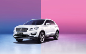 White SUV Lincoln MKC on a pink background