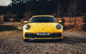 Yellow sports car Porsche 911 Carrera 4S, 2019