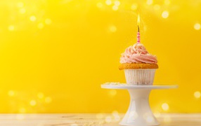 Appetizing cupcake with cream and one candle, template for birthday card