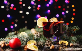 Two glasses of mulled wine on the table with fir branches