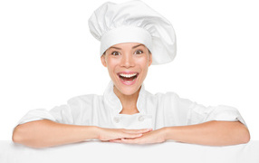 Smiling cook girl on white background