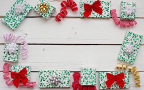 A lot of different gifts with bows on a wooden background, template for greeting card