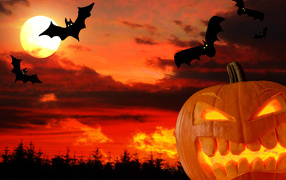 Scary pumpkin and bats on the background of the moon