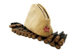 Military cap with red star with ammunition on a white background