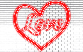 Красное сердце с надписью Любовь на кирпичной стене