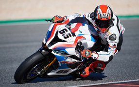 Motorcycle racer on a 2019 BMW S1000RR motorcycle