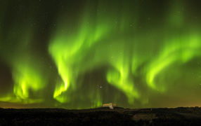 Beautiful green aurora borealis in the starry night sky