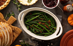 Green beans in a white roasting pan on the table