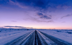 Ice-covered road against the sky