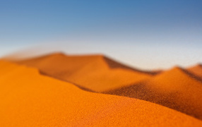 Yellow sand in the desert under the blue sky