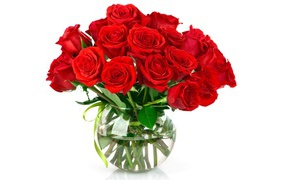 Bouquet of red roses in a glass vase on a white background