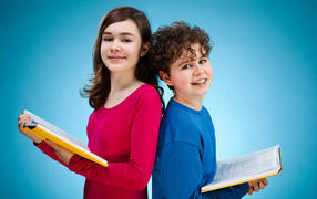 Boy and girl with books on a blue background