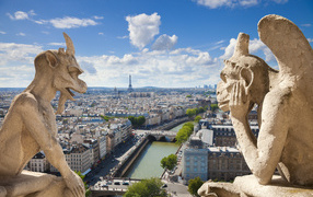 Gargoyle on the facade of Notre Dame de Paris. France
