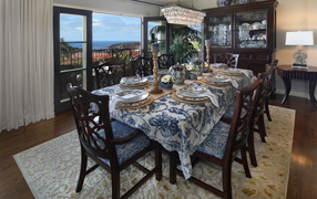 Dining room with large oak table and beautiful tableware