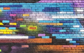 Multicolored graffiti on a brick wall