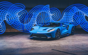 Blue Ford GT car in the background