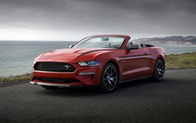 Red convertible Ford Mustang, 2020 by the sea