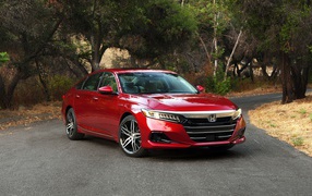 Red 2021 Honda Accord Touring Hybrid car on the road