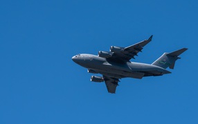 Big Boeing C-17 Globemaster III in the blue sky