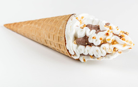 Ice cream cone with nuts and chocolate