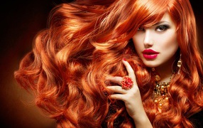 Beautiful curvy red hair of a girl