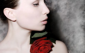 Beautiful girl with a rose flower on her body