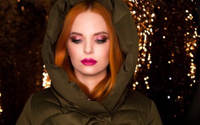 Beautiful red-haired girl in a warm jacket