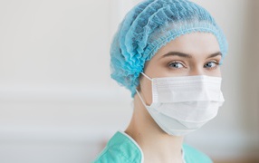Girl nurse in mask in hospital