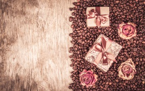 Gifts and roses lie on coffee beans