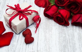 A beautiful bouquet of roses and a gift for your beloved on March 8