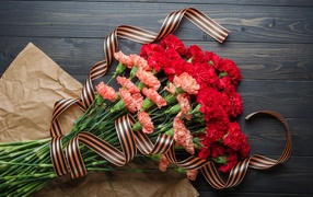 Bouquet of carnations with St. George ribbon for Victory Day on May 9