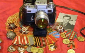 Camera, awards and old photo on May 9 Victory Day