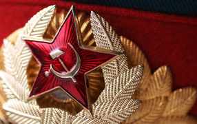 Red star with a sickle and a hammer on a cap