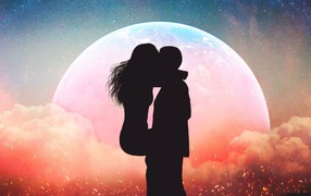Kiss of a couple in love on the background of the planet at night