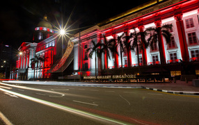 Red building of Singapore National Gallery at night, Asia