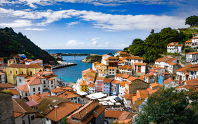 Houses in the village of Cudillero under the blue sky by the bay, Spain