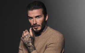 English footballer David Beckham with a watch on his hand
