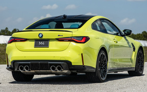 Yellow BMW M4 sports car, 2021
