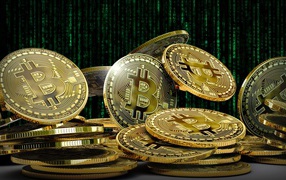 Lot of gold bitcoin coins close up