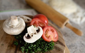 Pieces of tomato with herbs and mushrooms