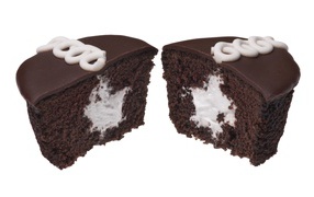 Chocolate muffin with filling on white background