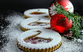 Cookies with powdered sugar and red balls